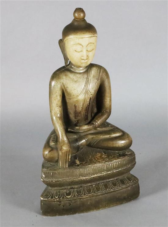 A large Burmese sculpted marble seated figure of Buddha, 18th/19th century H. 70cm, loss to ushnisha